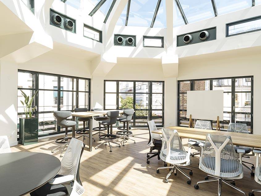 Leonard meeting room with natural light and collaborative workspace